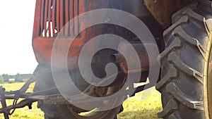 Exhaust pipe of a diesel engine pollutes the air. Exhaust pipe of old diesel tractor emitting black smoke and particul