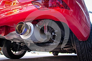 Exhaust pipe of red car