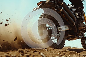 exhaust view, bike accelerating with dirt flying behind