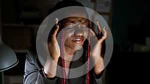 Exhausted african american woman worker in business attire, braids pulled tight, navigates online stress at her computer-lit