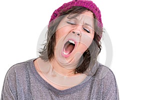 Exhausted or bored woman yawning