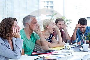 Exhausted business team in office