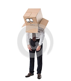 exhausted businessman with cardboard box on head standing