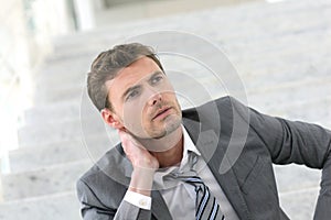 Exhausted businessman thinking about his future