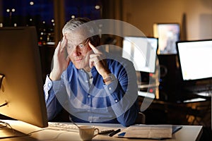 Exhausted businessman working late night