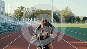 Exhausted couple after a break after a joint workout on athletics. Tired fitness couple resting after workout at the