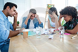 Exhausted creative business team riled up