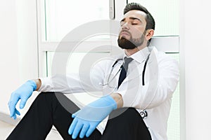 Exhausted doctor after long shift in the hospital