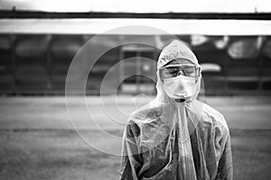 Exhausted emotional doctor/nurse wearing coronavirus protective gear N95 mask.Coronavirus Covid-19 pandemic outbreak.Frontline photo