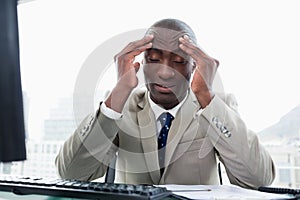 Exhausted entrepreneur working with a computer