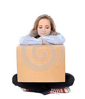 Exhausted girl with moving box