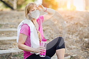Exhausted Girl Wearing Medical Face Mask During Workout Outdoors