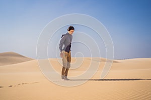 Exhausted man in the desert. Apathy, fatigue, exhaustion, mental disorders concept. Mental health