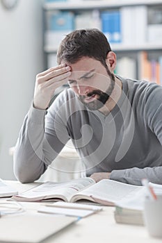 Exhausted man with headache