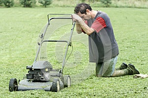 Exhausted Man with Lawn Mower