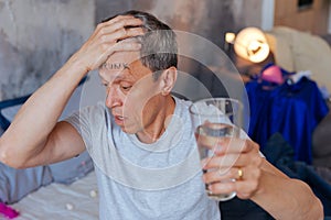 Exhausted mature man desiring water