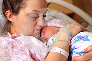 Exhausted Mom and Newborn photo