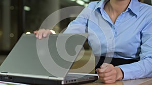 Exhausted office worker closing laptop and falling asleep on table, overtime