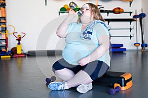 Exhausted Overweight Woman in Gym