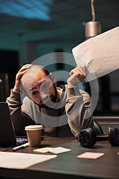 Exhausted overworked engineer programming html code
