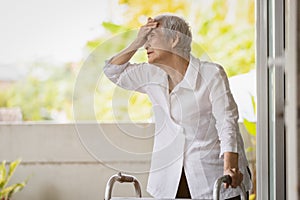 Exhausted senior woman has headache dizziness from the sizzling summer temperatures,old elderly suffering from hot summer weather,