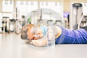 Exhausted woman in a gym
