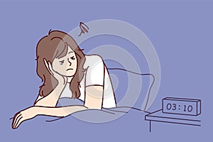 Exhausted woman sit in bed suffer from insomnia