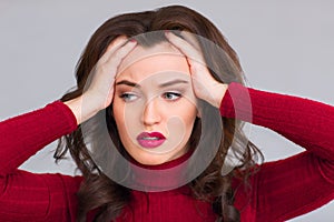 Exhausted woman touching her head