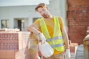 Exhausted young worker taking a break from work