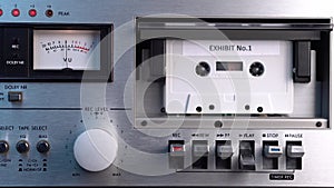 Exhibit No. 1 Audio Cassette Tape Rolling in Vintage Deck Player, Close Up
