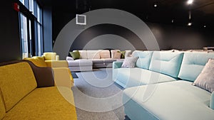 Exhibition of couches and sofas in a modern luxury furniture store