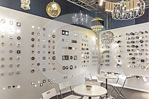 Exhibition stand with stylish lamps and chandeliers. Modern trends in decor and interior design