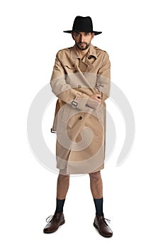 Exhibitionist in coat and hat isolated on white