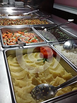 EXHIBITOR OF HOT MEALS TYPE BUFFET IN RESTAURANT AND HOTELS photo