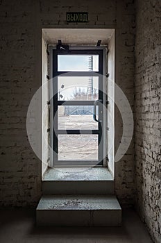 The exit door from the industrial premises, the inscription on the plate: Exit, in Russian