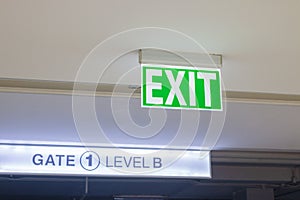 Exit doors with `Excit` hanging signs