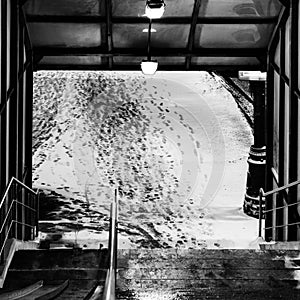 Exit from the pedestrian crossing. Pedestrian tracks in the snow. Winter conceptual composition