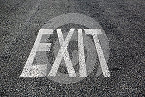 Exit sign on asphalt