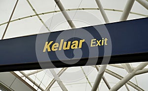 Exit sign board with train station ceiling background photo