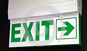 Exit sign, electrically operated glowing cabinet in a public place