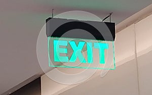 Exit sign in the glass.