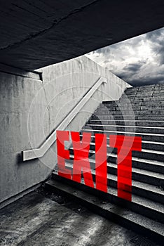 EXIT on Urban staircase in underground passage