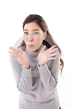 Exited, happy, smiling, joyful woman wearing grey sweater showing her pa