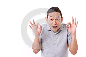 Exited man giving ok hand sign gesture