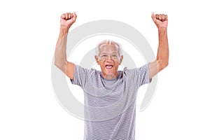 Exited senior old man laughing, raising his hands up