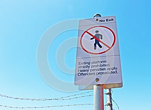 Exiting train platform strictly prohibited sign