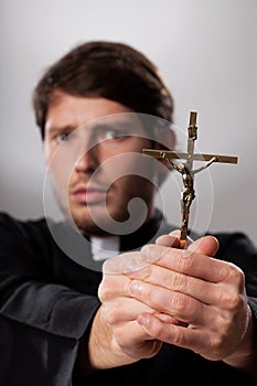 Exorcist with crucifix