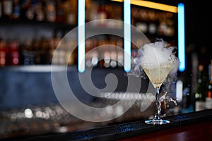 the exotic alcoholic cocktail with the smoke