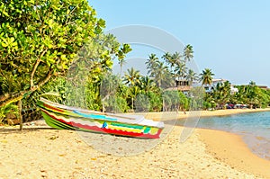 Exotic Asian beach with colorful boat, Sri Lanka