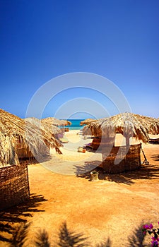 Exotic beach and gulf against blue sky.